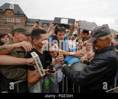 Worms, Germany. 24th Aug, 2018. Terence Hill sign s his autograph for his fans. Italian actor Terence Hill visited the German city of Worms, to present his new movie (My Name is somebody). Terence Hill added the stop in Worms to his movie promotion tour in Germany, to visit a pedestrian bridge, that is unofficially named Terence-Hill-Bridge (officially Karl-Kubel-Bridge). Credit: Michael Debets/Pacific Press/Alamy Live News Stock Photo