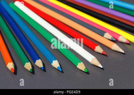 Pencils of different colors on gray background Stock Photo