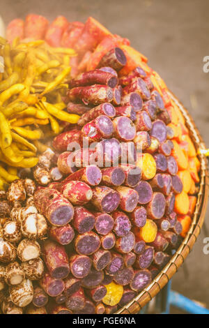 steamed sweet potato or cooked yams, yellow and purple. Stock Photo