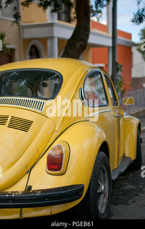 Yellow classic VW Beetle parked Stock Photo