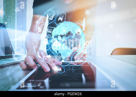 Internet of Things (IOT) technology with AR (Augmented Reality) on VR dashboard.Website designer working digital tablet and computer laptop and digita Stock Photo
