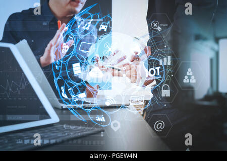 Internet of Things (IOT) technology with AR (Augmented Reality) on VR dashboard.co working team meeting concept,businessman using smart phone and digi Stock Photo
