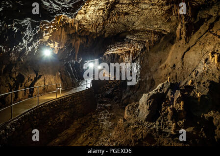 Cave with concrete footpath and light in Aggtelek, Hungary Stock Photo