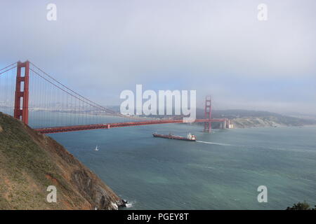 A ship passes under the Golden Gate Bridge, San Francisco, California, USA Stock Photo