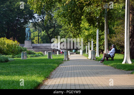 The formal garden at the Abraham Lincoln memorial in Chicago's Lincoln Park neighborhood provide a quiet place for city residents to relax. Stock Photo