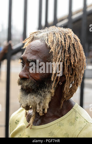 LOME, TOGO - Jan 9, 2017: Unidentified Togolese man with beard and dreads at the Lome port. Togo people suffer of poverty due to the bad economy Stock Photo