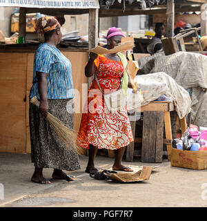 LOME, TOGO - Jan 9, 2017: Unidentified Togolese women work at the Lome port. Togo people suffer of poverty due to the bad economy Stock Photo