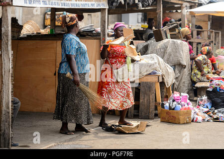 LOME, TOGO - Jan 9, 2017: Unidentified Togolese women work at the Lome port. Togo people suffer of poverty due to the bad economy Stock Photo