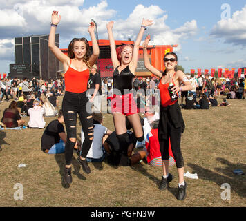 Crowds enjoy dancing in the sunshine in front of the main stage on day two at Reading Festival 25th august 2018