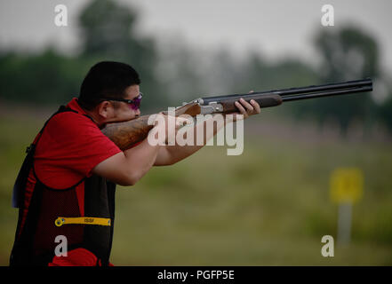 Palembang, Indonesia. 26th Aug, 2018. Jin Di of China competes during the men's skeet qualification of shooting at the 18th Asian Games 2018 in Palembang, Indonesia, Aug. 26, 2018. Credit: Wang Shen/Xinhua/Alamy Live News Stock Photo