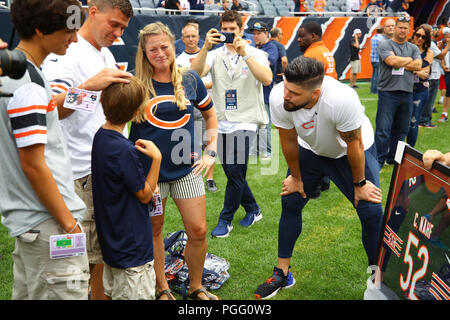 Illinois, USA. 25 August 2018. Bear Zach Miller presents a framed jersey to members of the family of Cameron Nahf, who passed away in May, during the NFL Game between the Kansas City Chiefs and Chicago Bears at Soldier Field in Chicago, IL. Photographer: Mike Wulf Credit: Cal Sport Media/Alamy Live News Stock Photo