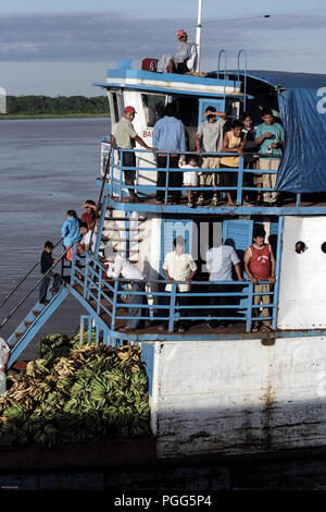 River ferry loaded with passengers and bananas on the Marañón River in Peru Stock Photo
