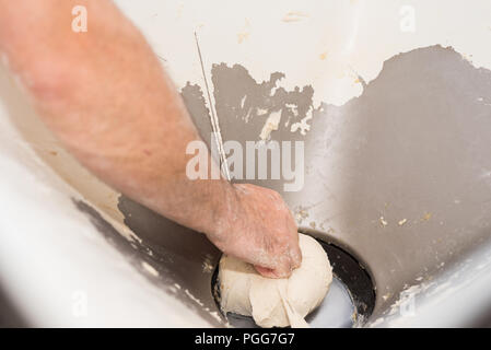 Baker hands kneading bread dough Stock Photo