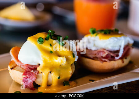 Delicious breakfast with eggs Benedict and juice Stock Photo