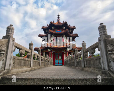 Traditional chinese pagoda at the end of a Bridge viewed from ground level, 228 Peace Memorial Park, Taipei Stock Photo