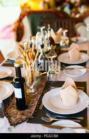 Table setting in a restaurant for romantic lunch or dinner Stock Photo