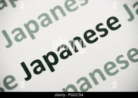 word Japanese language printed on white paper macro Stock Photo