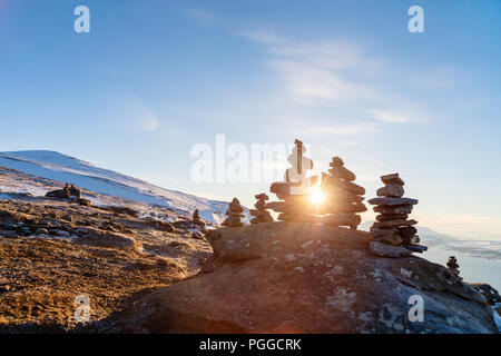 Stack of balanced stones on seashore Stock Photo