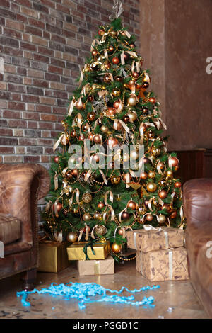 Christmas room after Christmas party. Party is over. Party streamers, party poppers on the floor Stock Photo