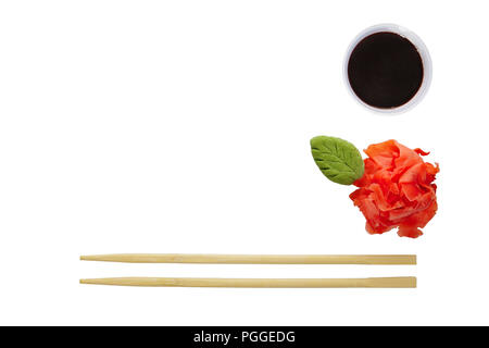 Flat layout - chopsticks, wasabi, pickled ginger and soy sauce isolated on white background. Photo with clipping path. Stock Photo
