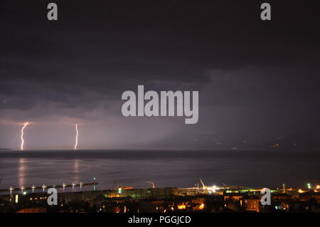 Thunderstorm with rain and black clouds over Adriatic sea Stock Photo