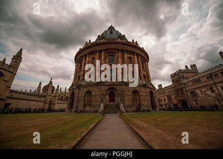The Radcliffe Camera, part of the Bodleian library, at the University of Oxford, England, with a moody sky, an amazing piece of architecture.