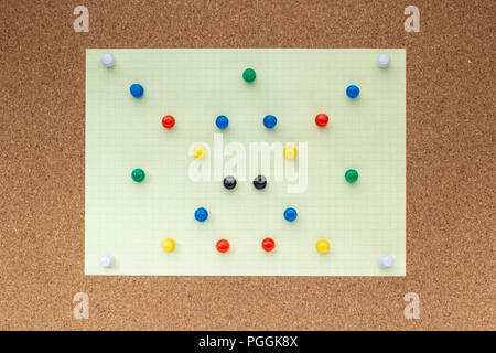 Many colored buttons on a cork board Stock Photo