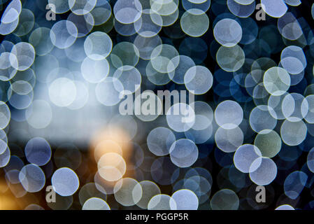 Bokeh abstract texture. Defocused background. Blurred bright light. Circular points. Stock Photo