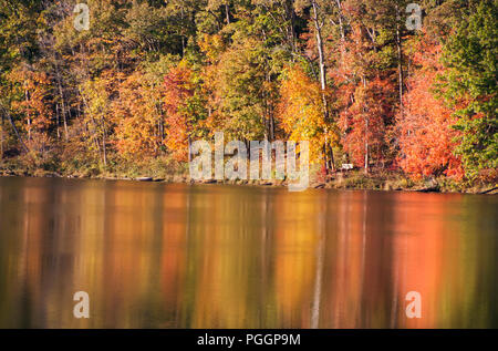 Autumn leaves reflected onto a lake Stock Photo