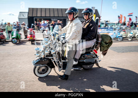 The Annual Bank Holiday Mod Weekender in Brighton today. A couple arriving on the seafront. Stock Photo