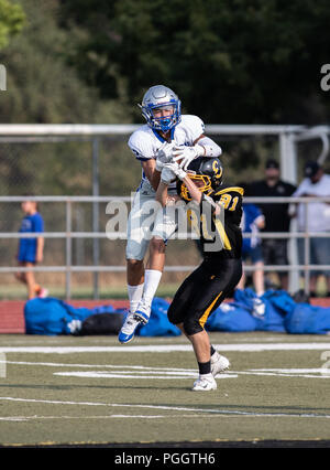 Football action with McQueen High School junior varsity at Enterprise junior varsity in Redding, California. Stock Photo