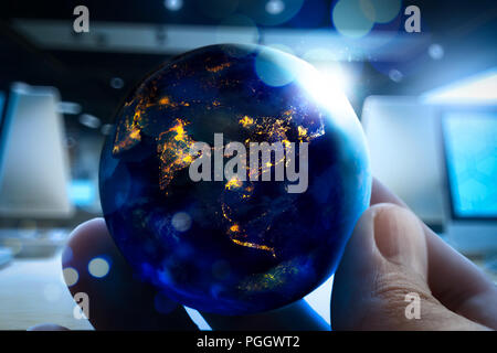 Close up of Earth at night was holding in human hands for Earth day and Energy saving concept,Elements of this image furnished by NASA Stock Photo