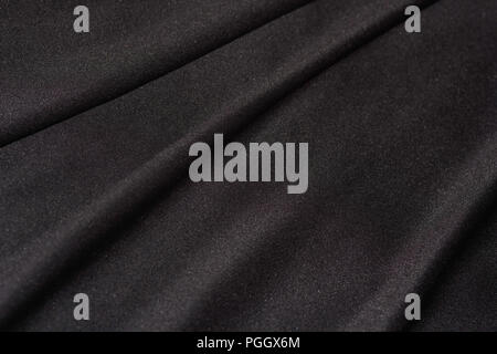 Black Satin Textile Fabric Folds Close-up Stock Photo