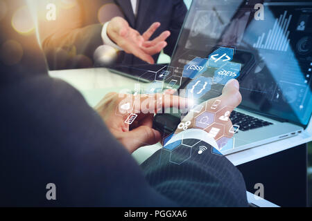 Coding software developer work with augmented reality dashboard computer icons of scrum agile development and code fork and versioning with responsive Stock Photo