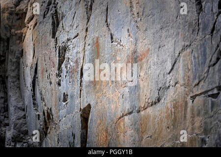 Pictographs of humans and animals painted with ochre in Grotto Canyon, about 65 kilometers west of Calgary. Stock Photo