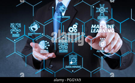 Machine learning technology diagram with artificial intelligence (AI),neural network,automation,data mining in VR screen.Businessman hand pressing an  Stock Photo