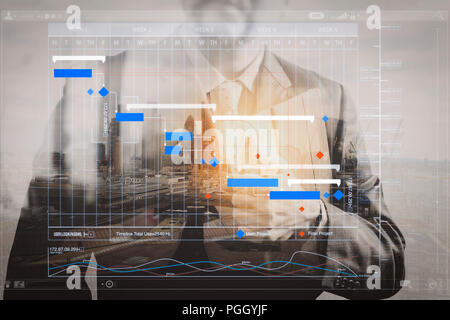 Project manager working and update tasks with milestones progress planning and Gantt chart scheduling virtual diagram.success businessman holding digi Stock Photo
