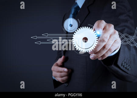 Thinking about structuring virtual diagram of business process with solutions. Businessman hand pressing an imaginary button on virtual screen Stock Photo