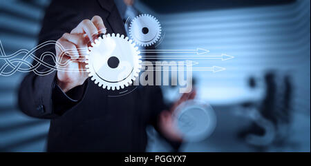 Thinking about structuring virtual diagram of business process with solutions. Businessman hand pressing an imaginary button on virtual screen Stock Photo