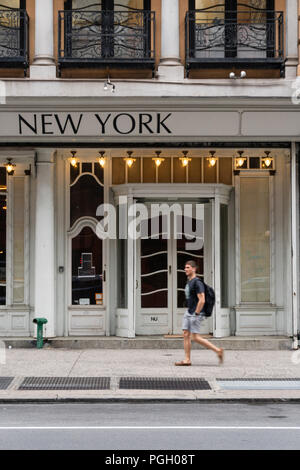 Man walking on the street in New York City Stock Photo