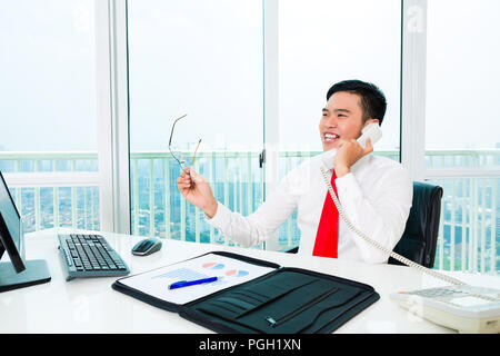 Asian businessman working in office Stock Photo