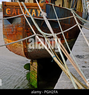 Rusting stern of the trawler 'Village Queen', Kilronan pier, Inishmore, Aran Islands. Stock Photo