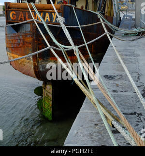 Rusting stern of the trawler 'Village Queen', Kilronan pier, Inishmore, Aran Islands. Stock Photo