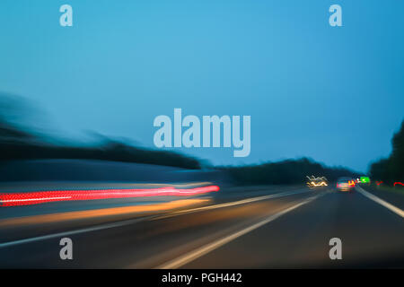 Abstract lines of traffic on highway at sunset. Stock Photo