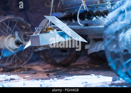 Astronaut Drives Rover. Smart moon-rover performs research work on the moon Stock Photo