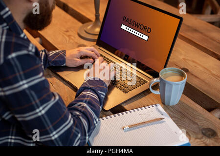 Cropped image of a young man working on his laptop in a coffee shop, rear view of business man hands busy using laptop at office desk, young male stud Stock Photo