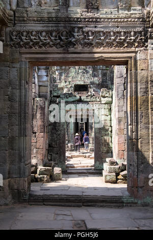 People walking through the Preah Khan Temple in Siem Reap, Cambodia Stock Photo