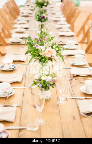 Tables Set With Vintage Retro Crockery For Afternoon Tea Party