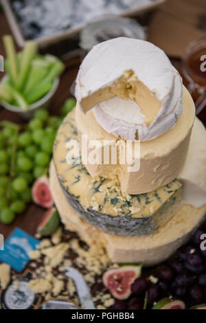 Cheese cake tower made up of various different cheese wheels farmed locally in Lancashire Stock Photo