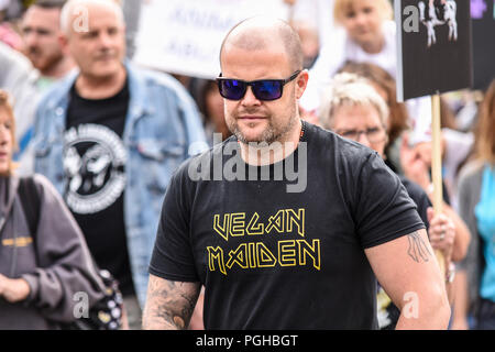 The Official Animal Rights March taking place with protesters outside the Houses of Parliament organised by Surge consisting of vegans protesting Stock Photo